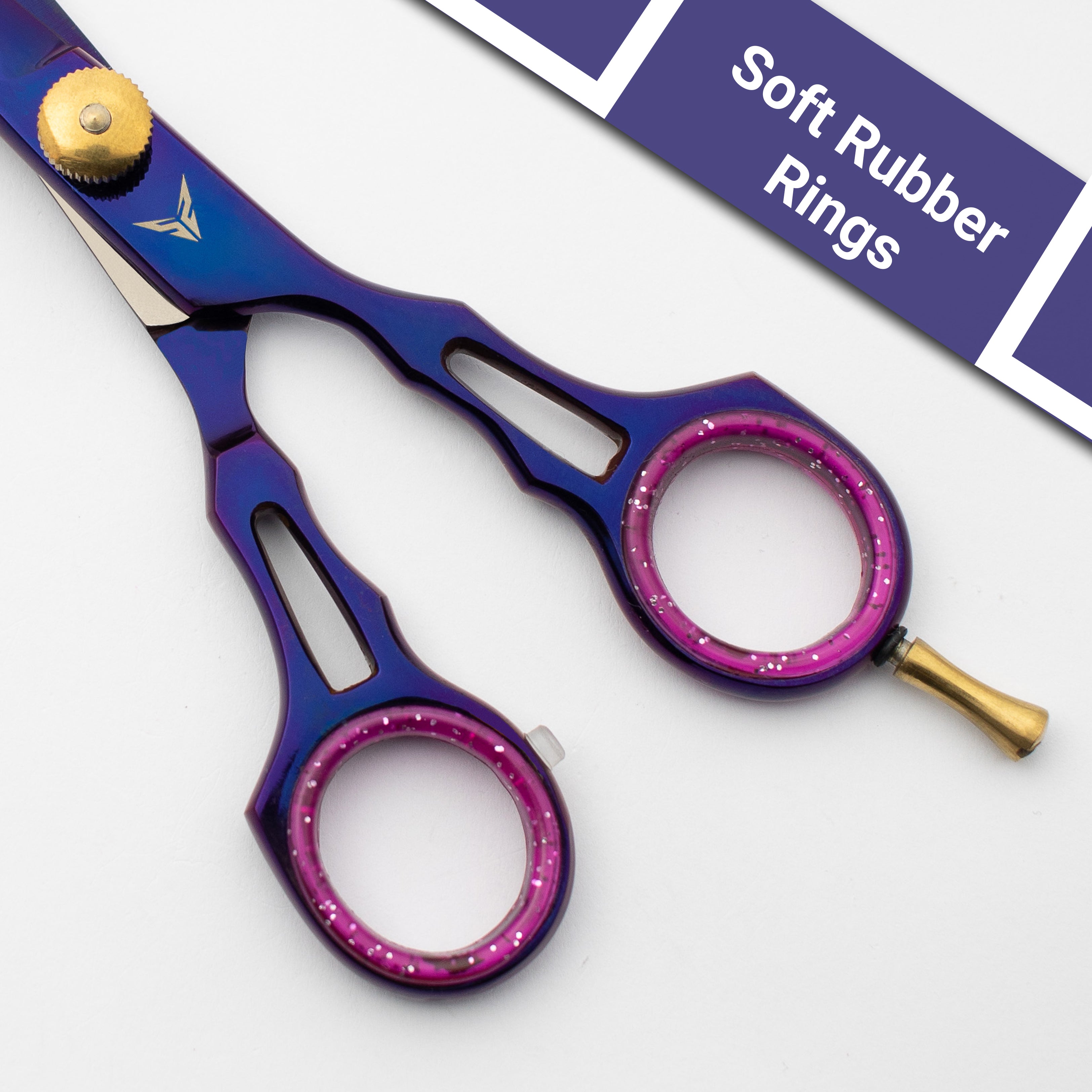 Blue and purple scissors with pink rubber rings on a white background