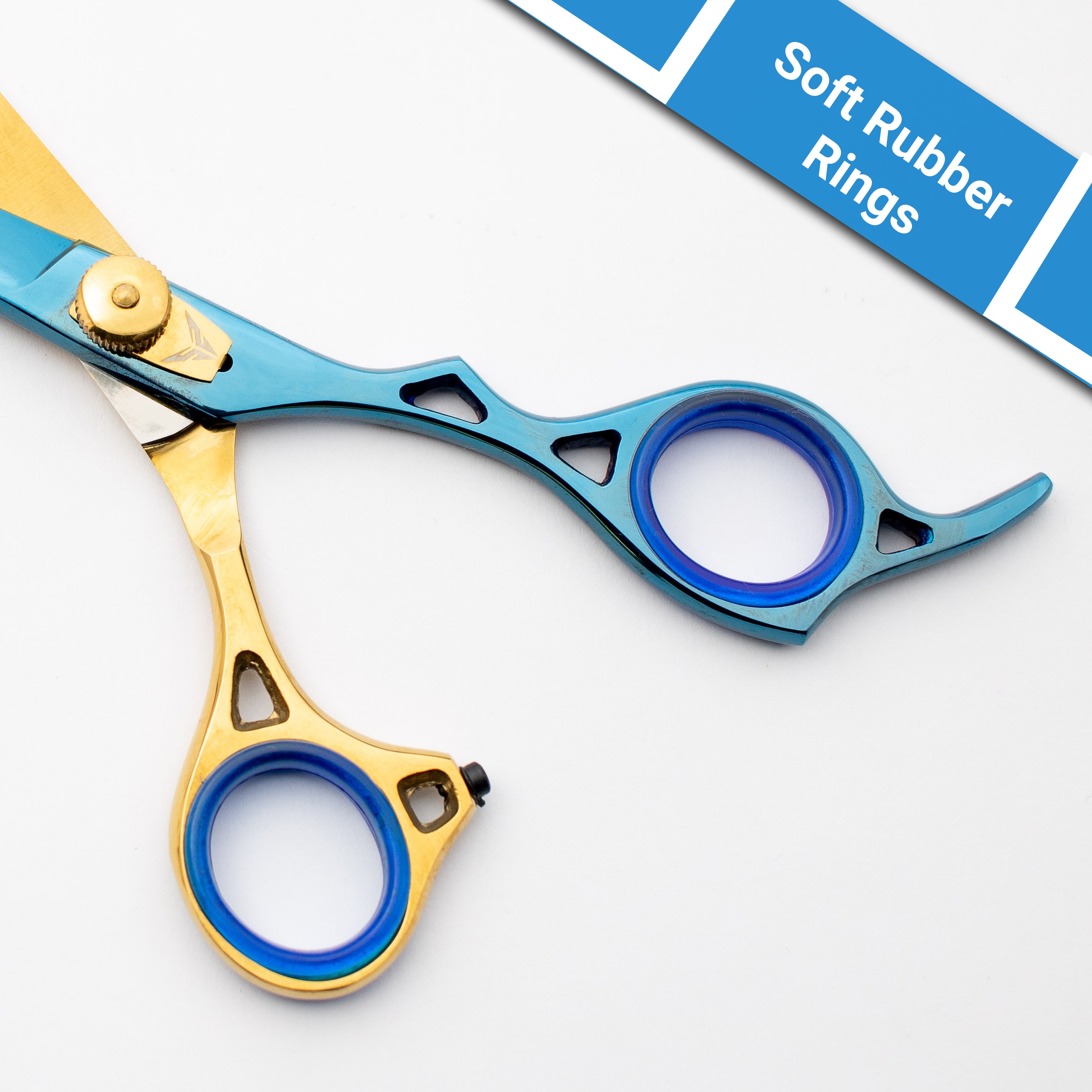Gold and blue scissors with soft rubber rings on a white background
