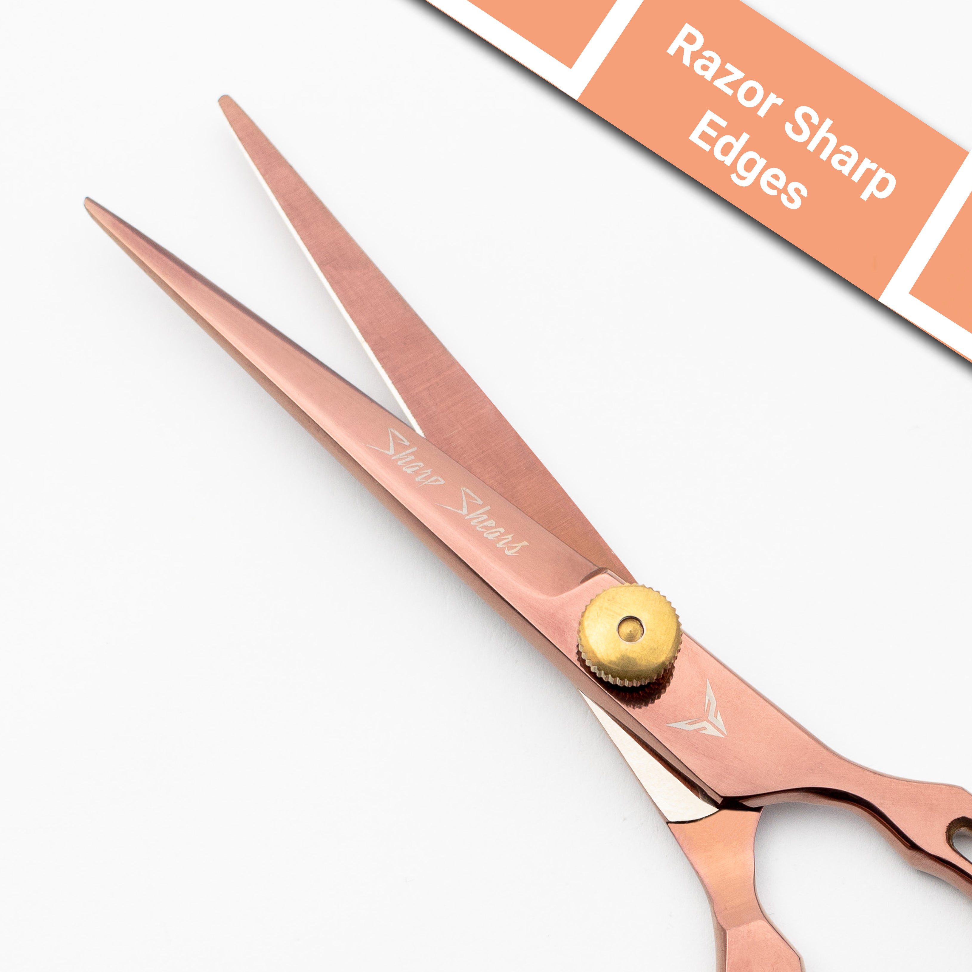 Rose gold scissors with a gold button on a white background