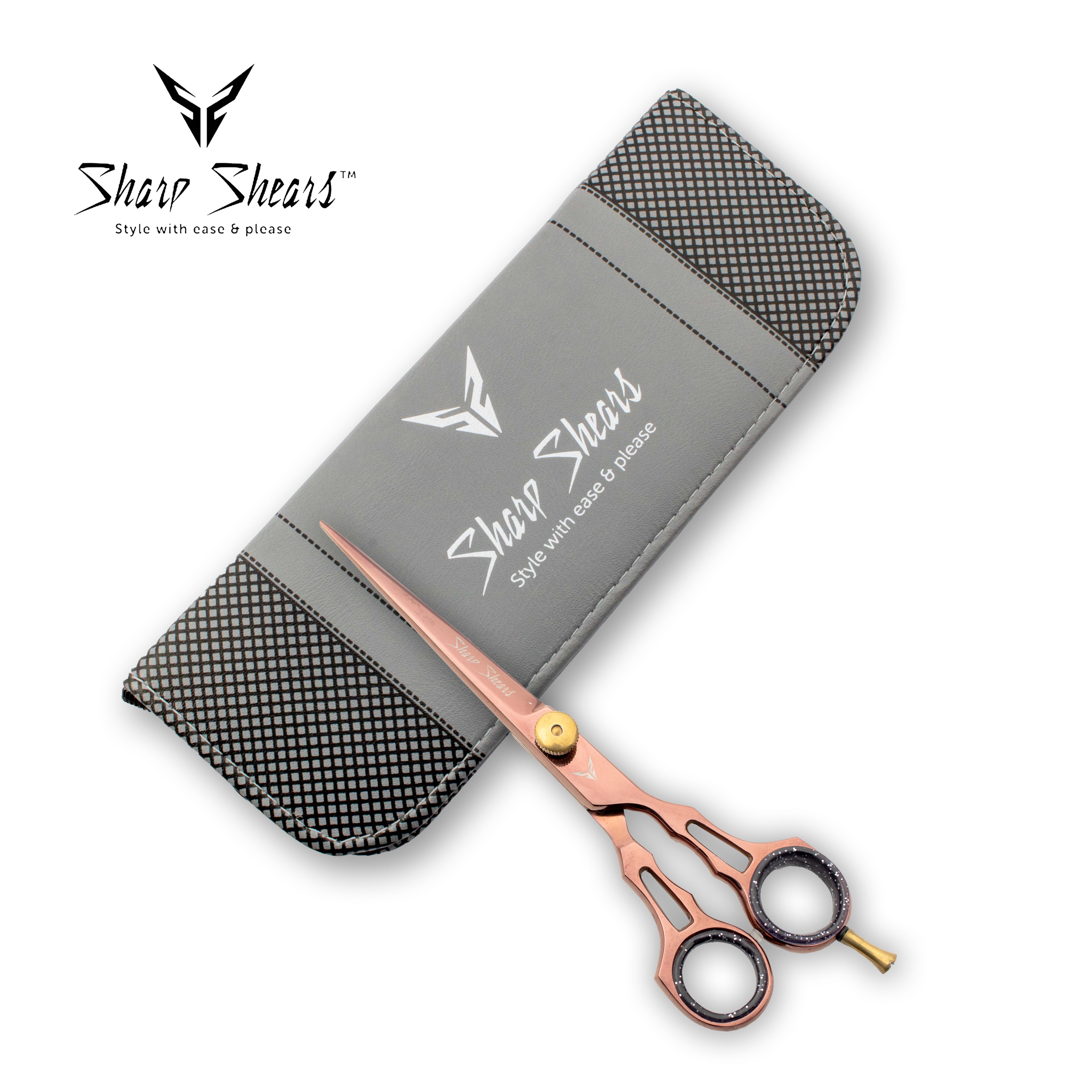Rose gold scissors with a gray case featuring 'Sharp Shears' branding on a white background.